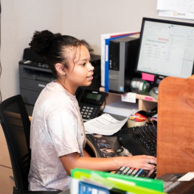 Receptionist taking appointments at Tons of Tread